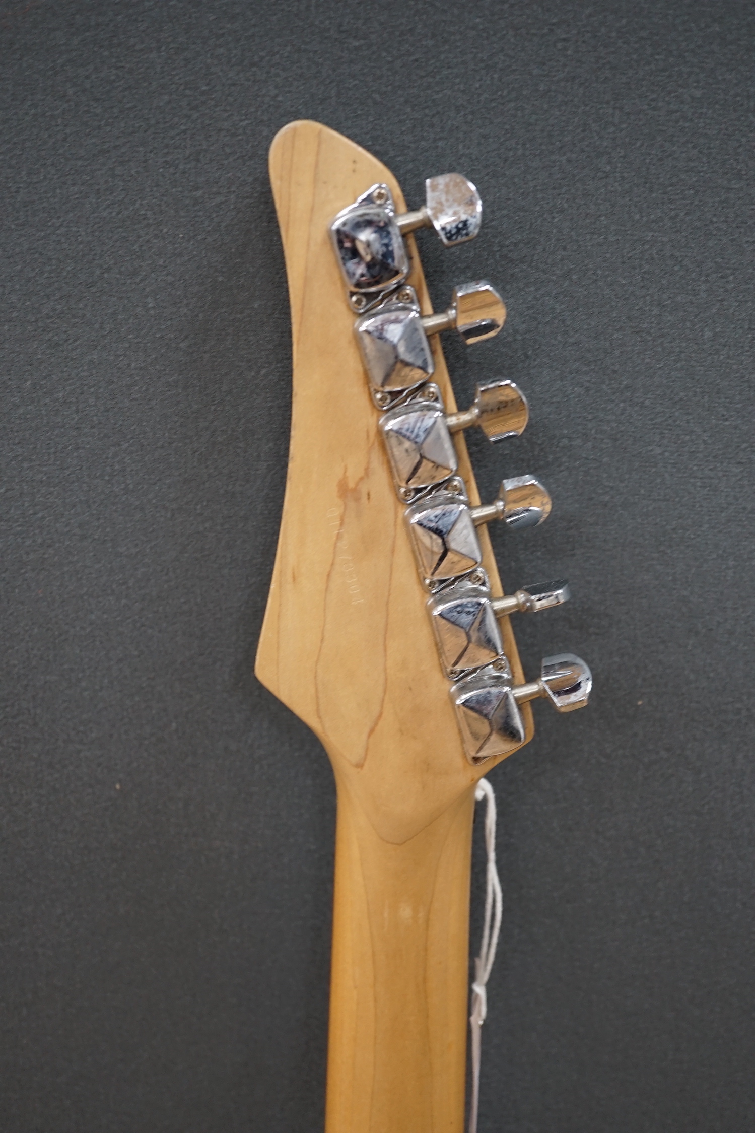 A Yamaha electric guitar, ERG 121, with black lacquer body and a small Carlsbro Kickstart practice amp